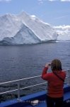 Photo: Woman Iceberg Watching Boat Tour Iceberg Alley Newfoundland