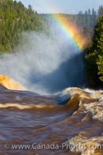 A wonderful rainbow falls into the watery mists of the Kakabeka Falls.