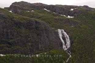 The landscape of the Mealy Mountains in Southern Labrador is greenery, rock cliffs and an assortment of falls that cascade down the mountain range.