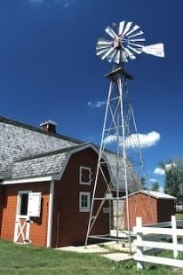 A windmill and barn are part of the displays at the Mennonite Heritage Village in Steinbach, Manitoba.