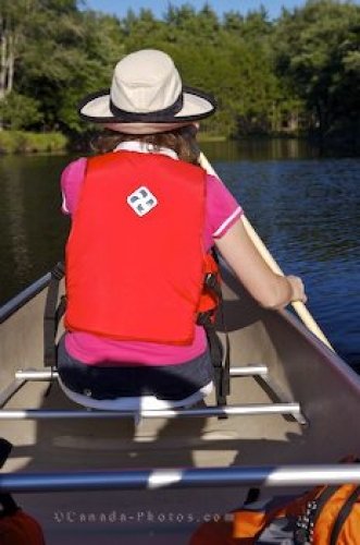 Photo: Woman Canoeing Mersey River Kejimkujuk National Park Nova Scotia