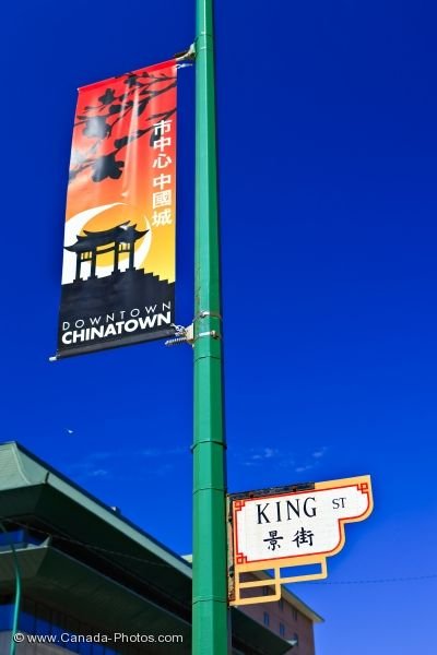 Photo: Chinatown Street Sign With Banner Winnipeg City Manitoba